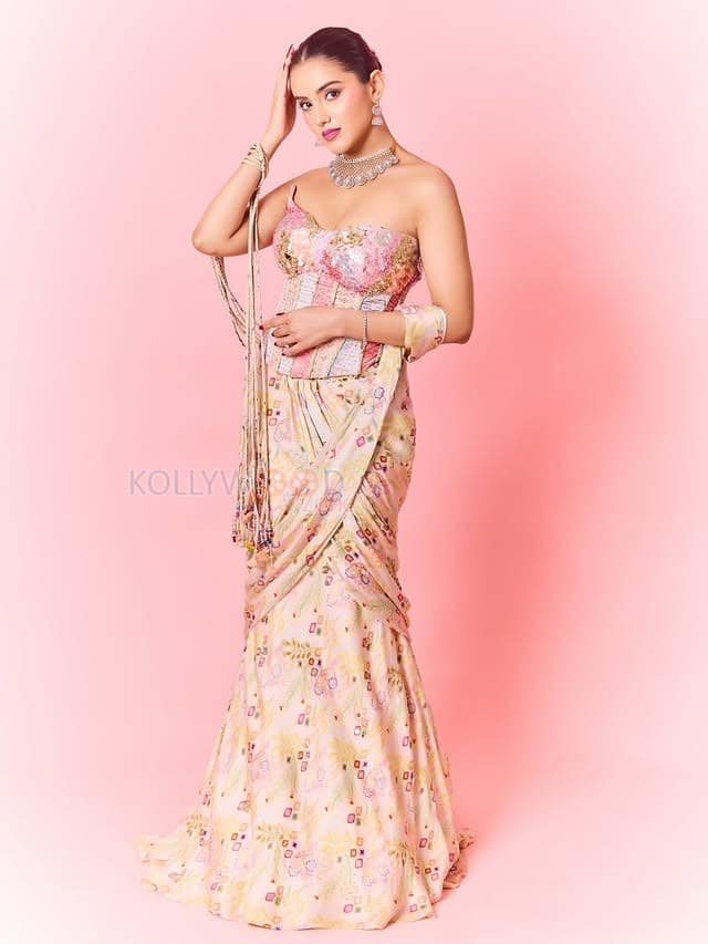 Hot Malvika Sharma in a Pastel Pink Sequined Embroidered Corset Top with Floral Embellishments and Pre Draped Saree Pictures 04