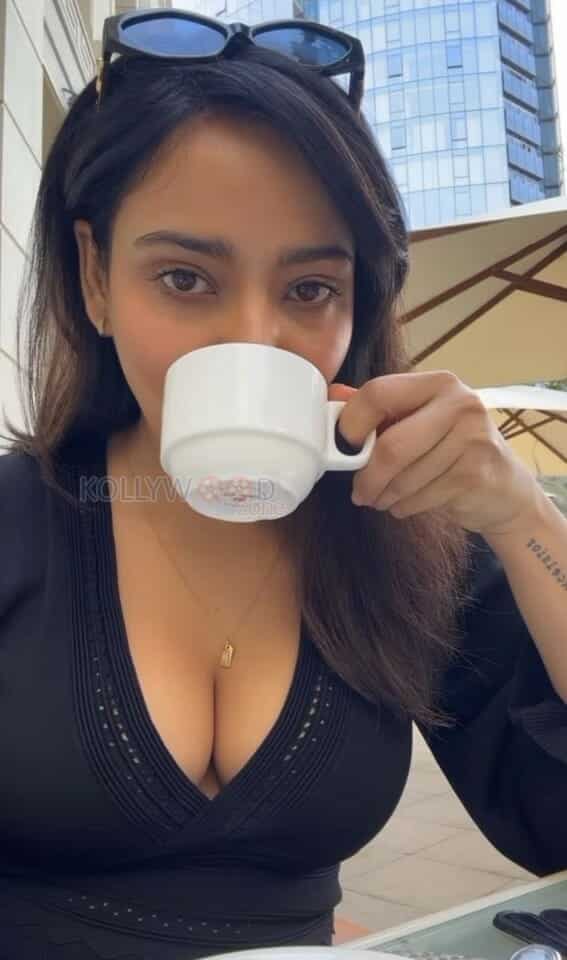 Hot Neha Sharma Drinking Coffee and Showing Erotic Cleavage Photos 01