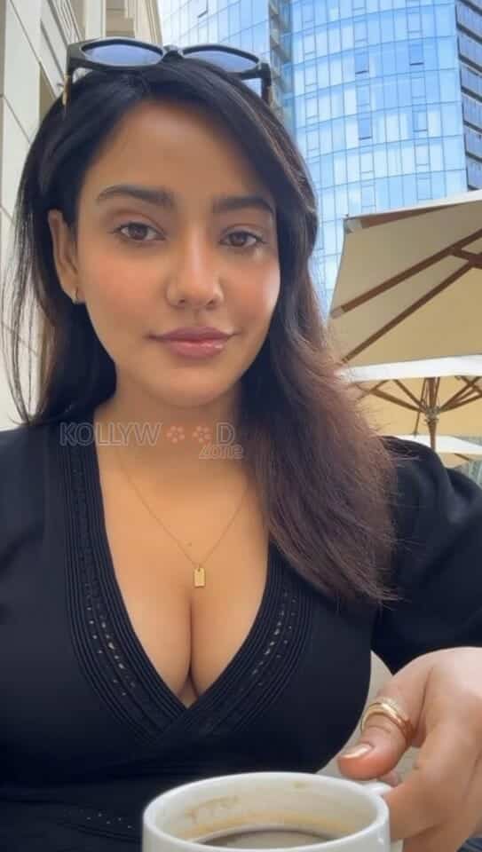 Hot Neha Sharma Drinking Coffee and Showing Erotic Cleavage Photos 02