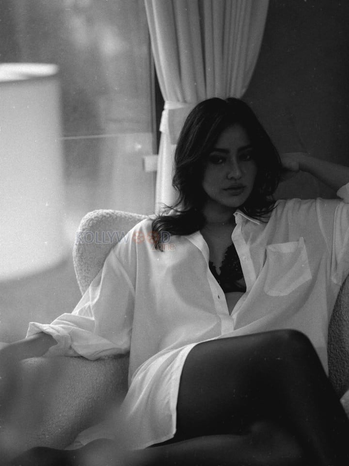 Hot Neha Sharma in a Black Lace Bra and Oversized White Shirt Photos 05