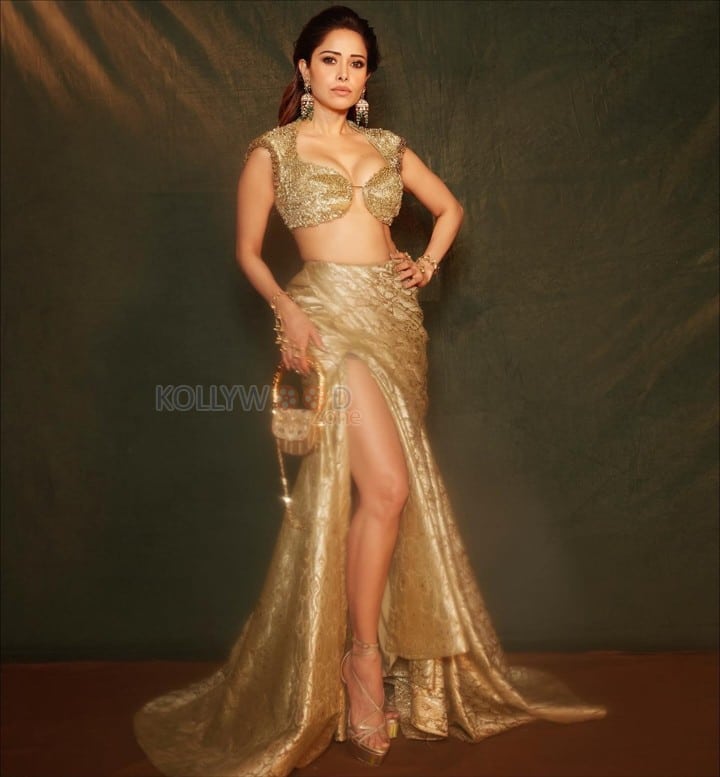 Hot Nushrratt Bharuccha in a Busty Cleavage Golden Bra Top with a Thigh High Slit Skirt Pictures 05