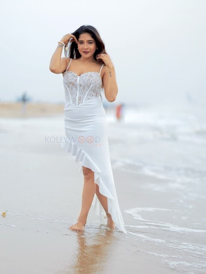Hot Sakshi Agarwal in a White Sleeveless Lace Maxi Dress Pictures 01
