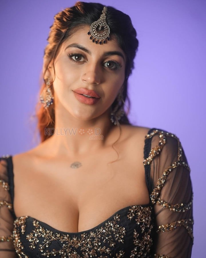 Hot Yashika Aannand in a Black Embroidered Netted Sleeve Top with a Black Skirt Photos 02