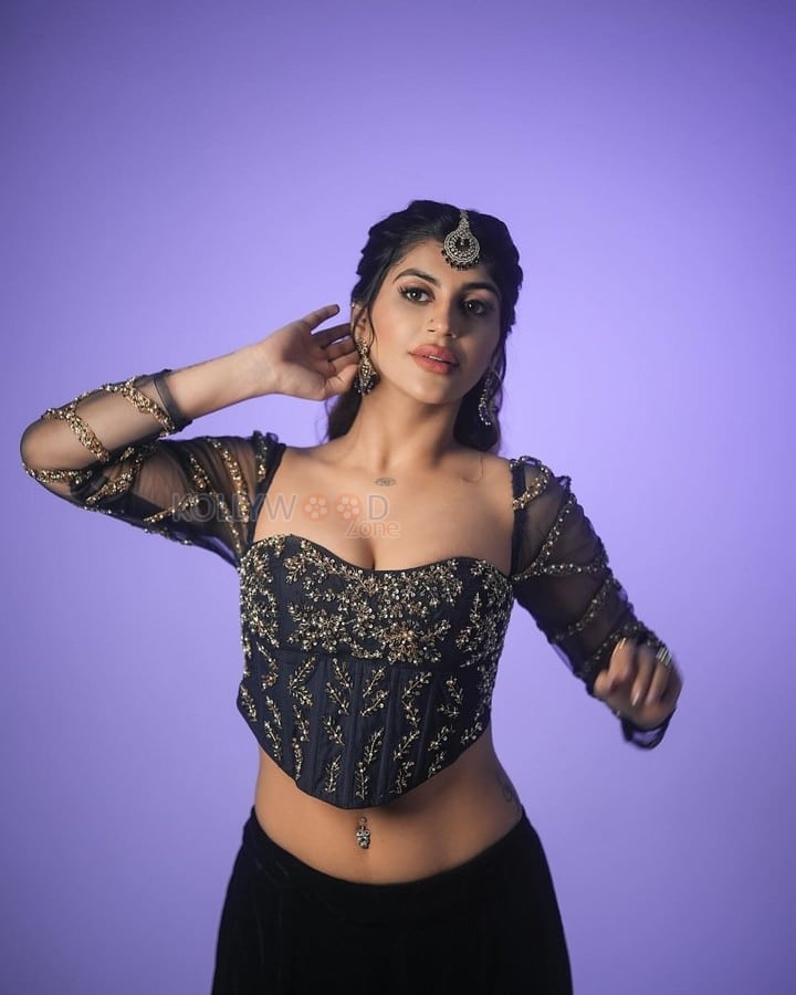 Hot Yashika Aannand in a Black Embroidered Netted Sleeve Top with a Black Skirt Photos 03