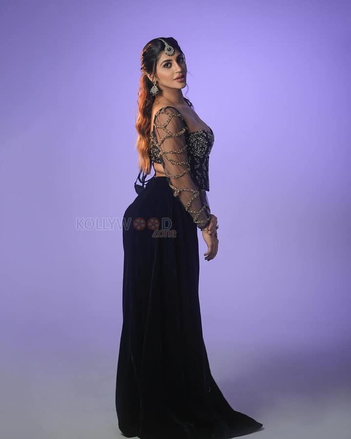Hot Yashika Aannand in a Black Embroidered Netted Sleeve Top with a Black Skirt Photos 08