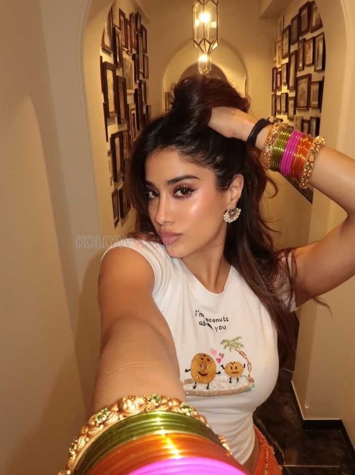 Hot and Sexy Janhvi Kapoor in a White Crop Top and Orange Mini Skirt Photos 02