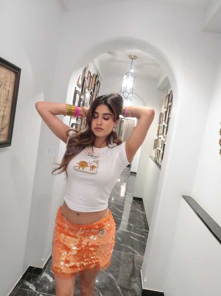 Hot and Sexy Janhvi Kapoor in a White Crop Top and Orange Mini Skirt Photos 03