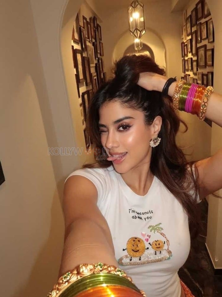 Hot and Sexy Janhvi Kapoor in a White Crop Top and Orange Mini Skirt Photos 04