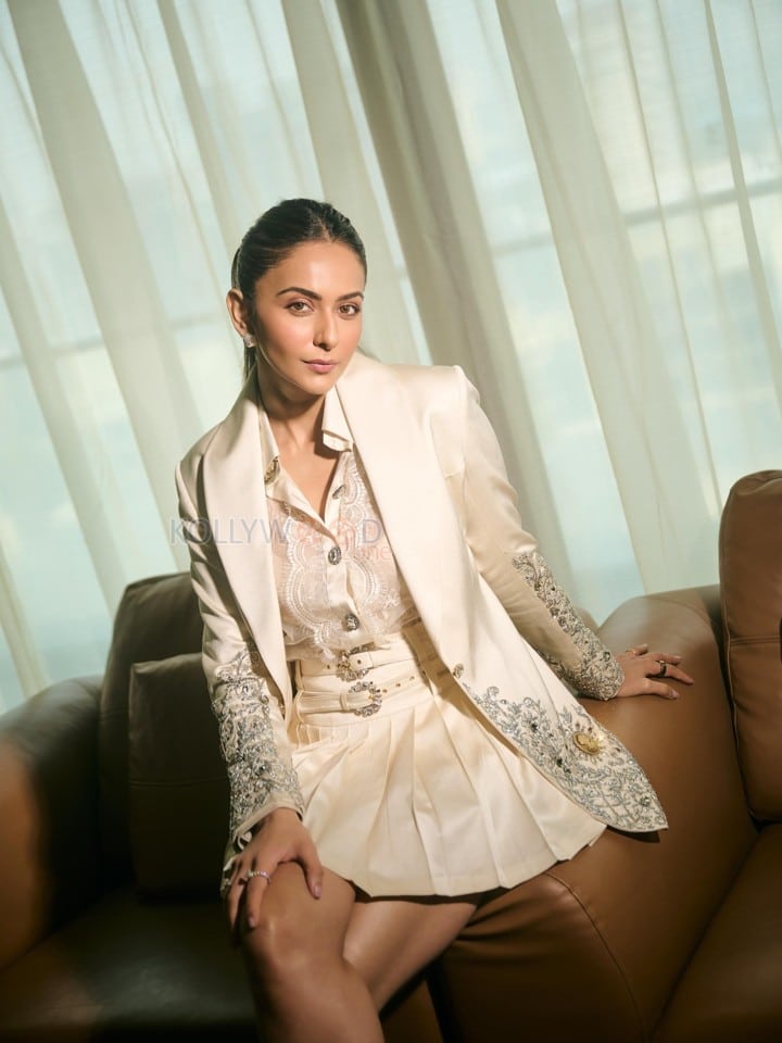 Indian Actress Rakul Preet Singh in an Ivory Blazer with Floral Lace Shirt and Mini Skirt Pictures 04