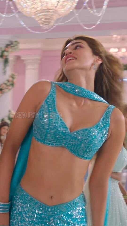 Kriti Sanon Showing Cleavage in a Song and Dance Routine Photos 01