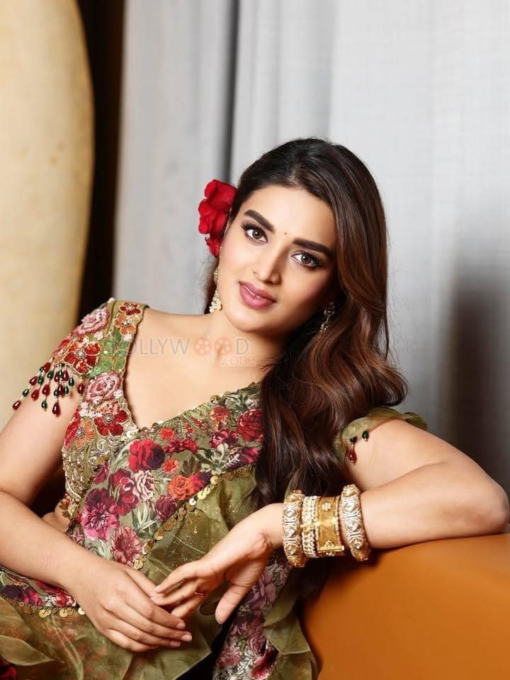 Lovely Nidhhi Agerwal in a Floral Green and Red Lehenga Photos 03