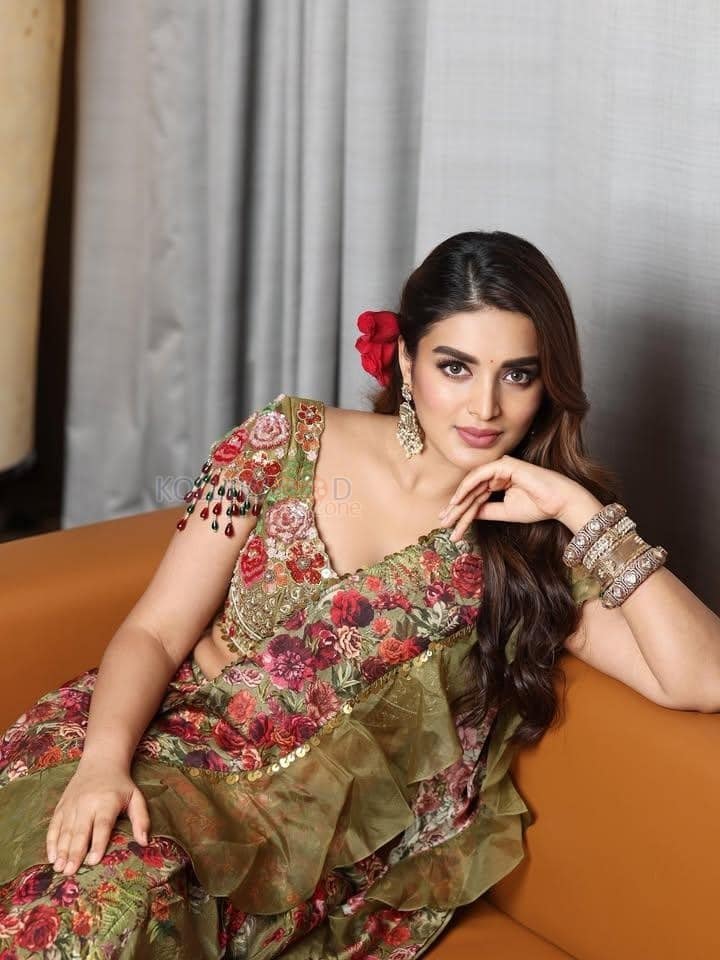 Lovely Nidhhi Agerwal in a Floral Green and Red Lehenga Photos 04