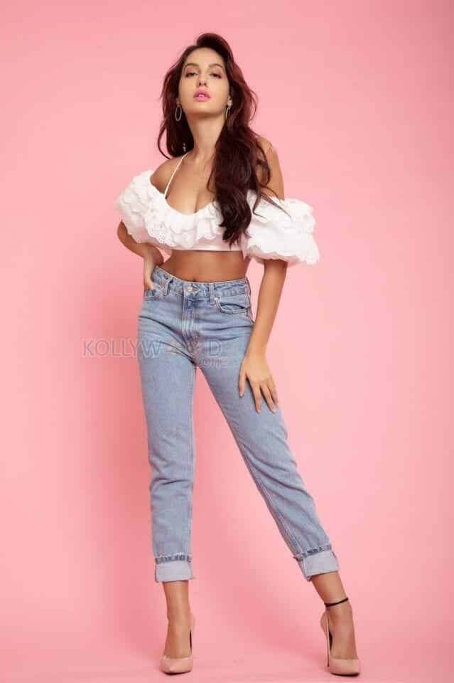 Nora Fatehi in a Denim Pant and Deep Cleavage Showing Top Photo 01