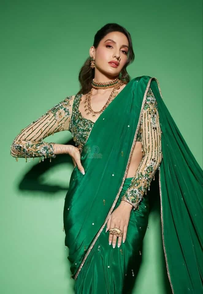 Nora Fatehi in a Green Saree Photo 01