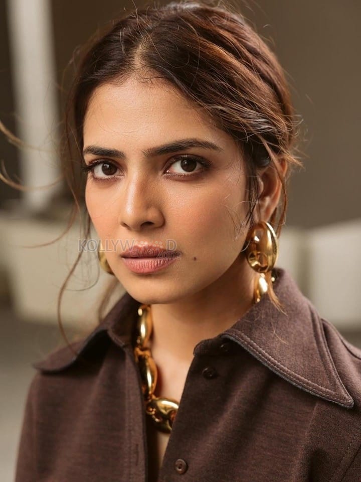 Pretty Hot and Sexy Malavika Mohanan in a Brown Gucci Collared Top with Matching High Waist Trousers Photos 03