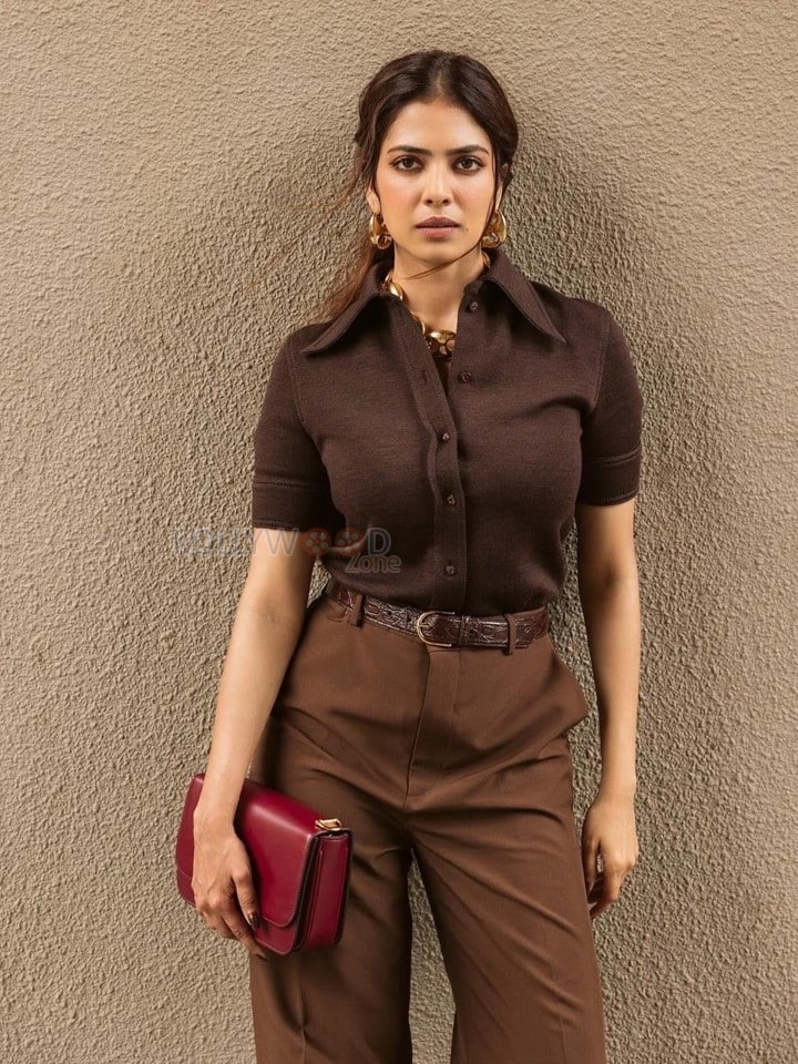 Pretty Hot and Sexy Malavika Mohanan in a Brown Gucci Collared Top with Matching High Waist Trousers Photos 04