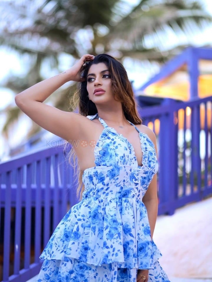 Ravishing Glam Yashika Aannand in a Blue Halter Neck Floral Dress Photos 02