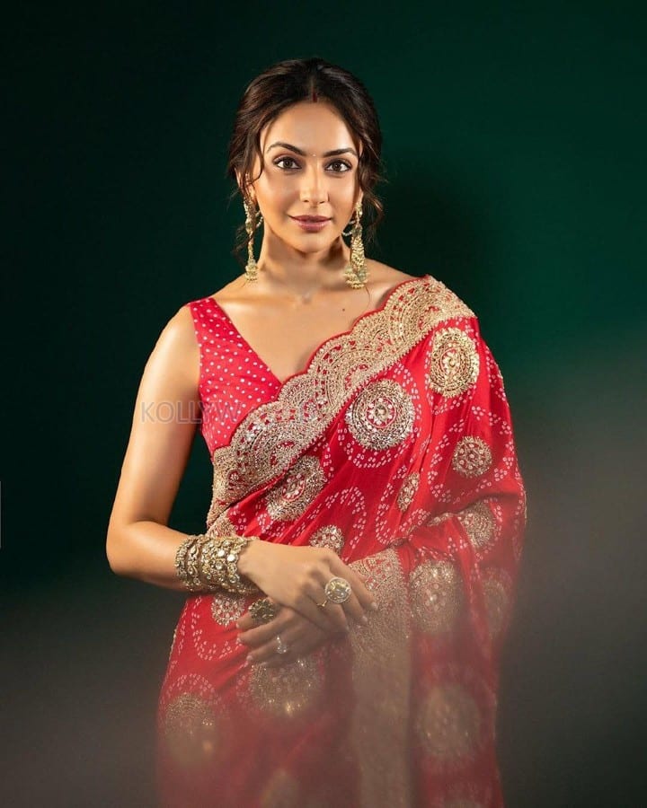 Ravishing Rakul Preet Singh in a Royal Red Saree with a Matching Sleeveless Blouse Pictures 05