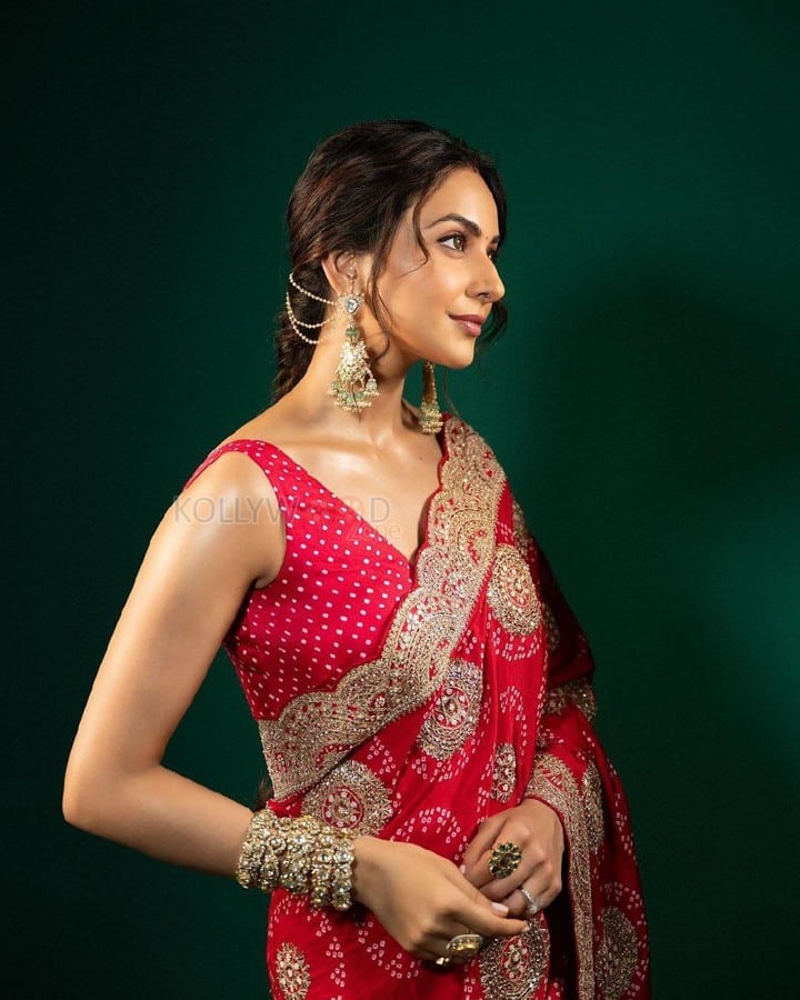 Ravishing Rakul Preet Singh in a Royal Red Saree with a Matching Sleeveless Blouse Pictures 06