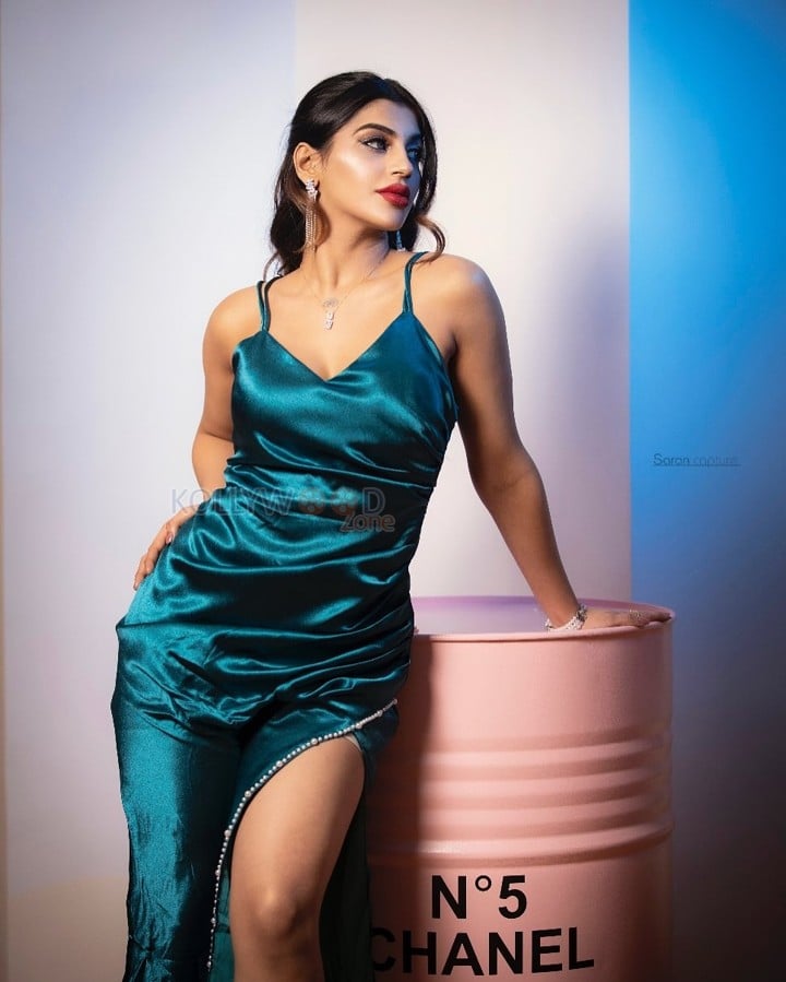 Seductive Yashika Aannand in a Teal Satin Thigh Slit Bodycon Dress Photos 02