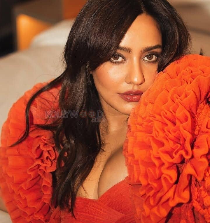 Sensual Neha Sharma in an Orange Floor Length Gown with a Bold Cleavage Cut Out Photos 04