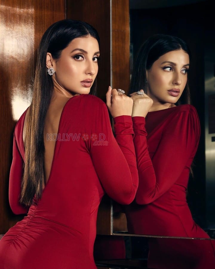 Sexy Actress Nora Fatehi in a Red Bodycon Backless Dress Photoshoot Pictures 05