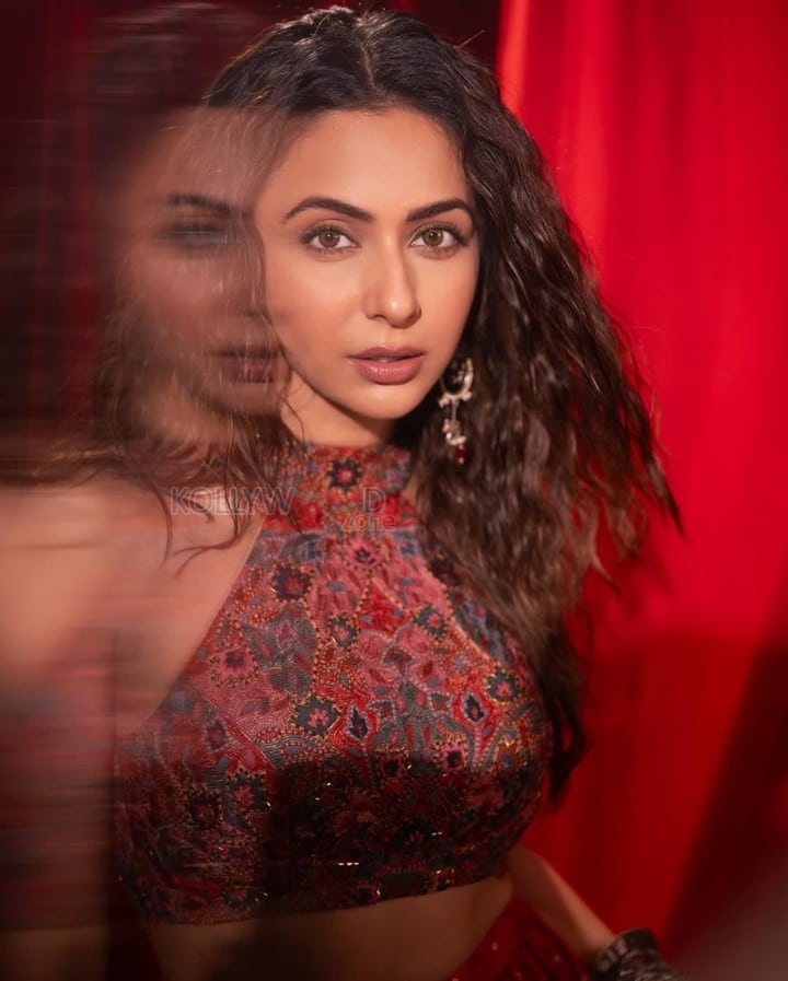 Sexy Actress Rakul Preet Singh in a Red and Maroon Embroidered Halter Neck Crop Top with a Matching Flared Lehenga Skirt Photos 02