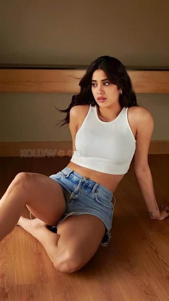 Sexy Janhvi Kapoor in a White Top and Blue Mini Shorts Photos 02