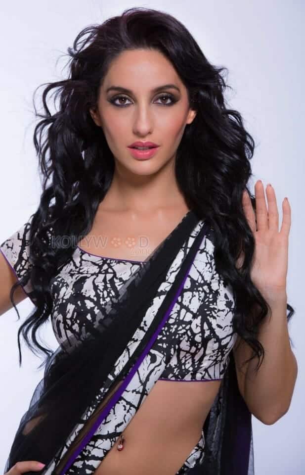 Sexy Singer and Dancer Nora Fatehi Black Saree Photoshoot Pictures 04