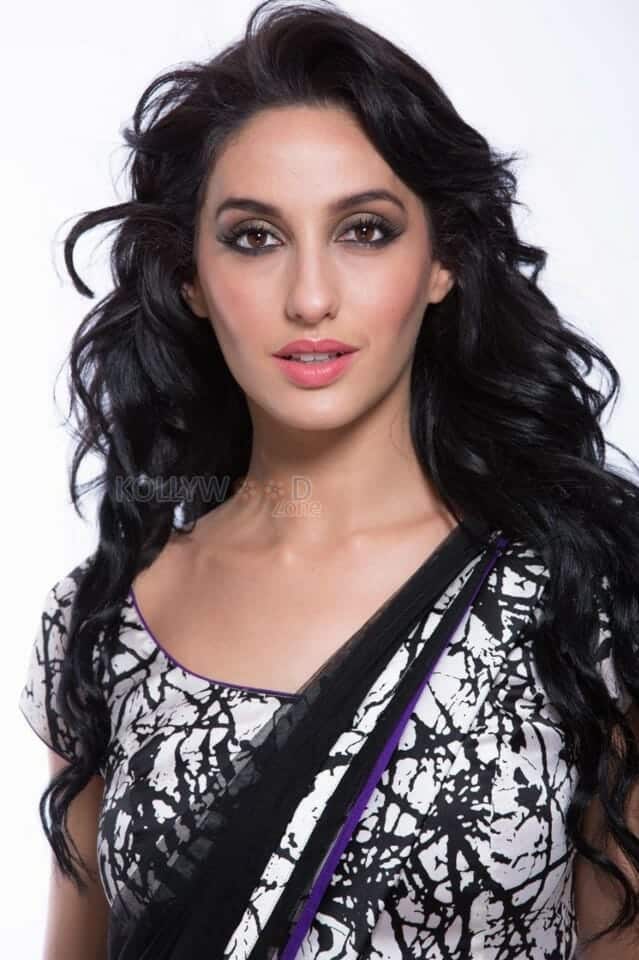 Sexy Singer and Dancer Nora Fatehi Black Saree Photoshoot Pictures 06