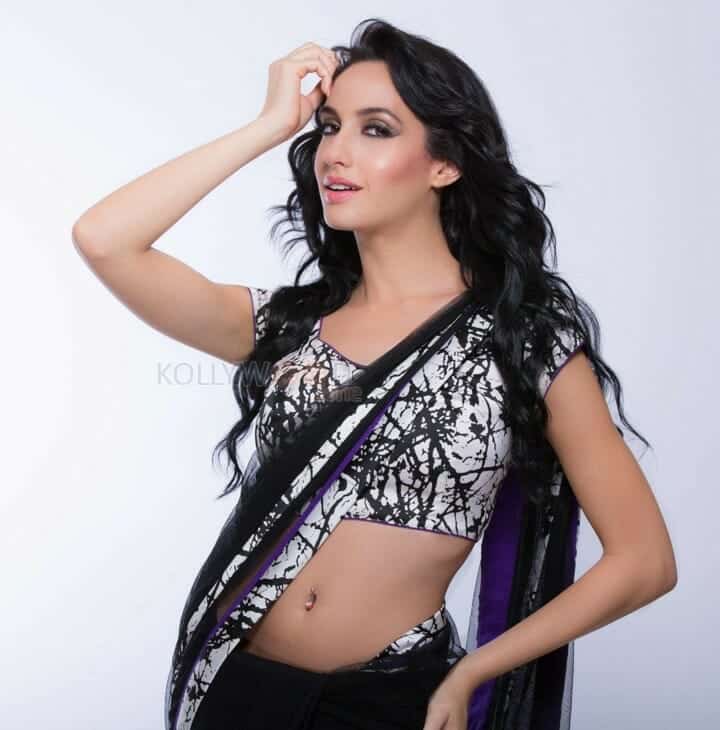 Sexy Singer and Dancer Nora Fatehi Black Saree Photoshoot Pictures 07