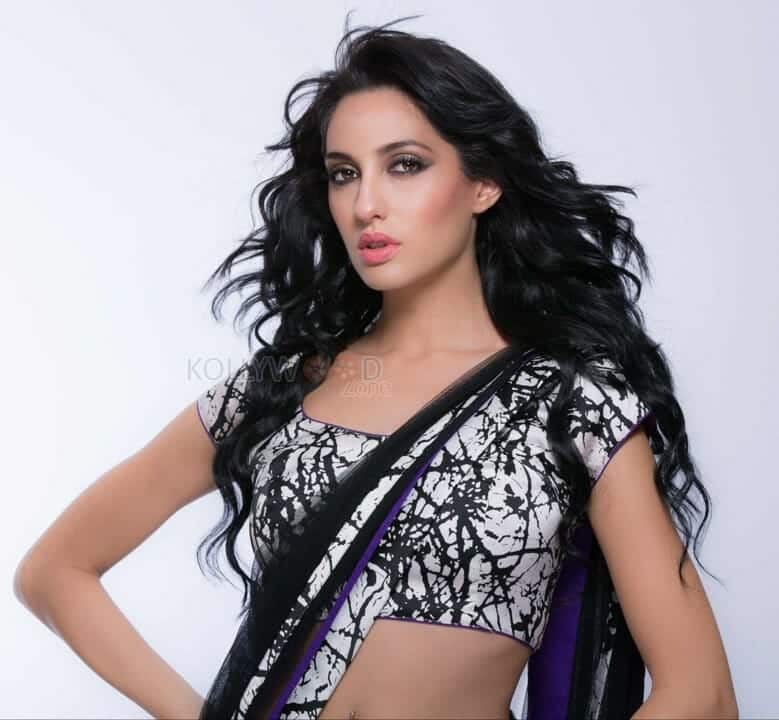 Sexy Singer and Dancer Nora Fatehi Black Saree Photoshoot Pictures 08