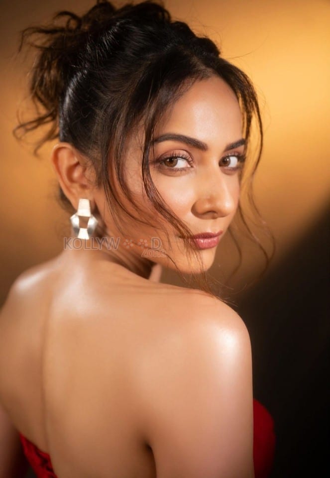 Sizzling Hot Rakul Preet Singh in a Red Corset Strapless Top with a Thigh High Slit Skirt Photos 04