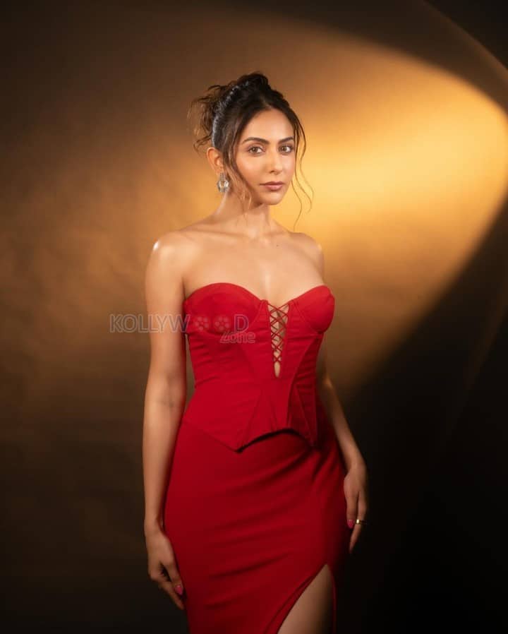 Sizzling Hot Rakul Preet Singh in a Red Corset Strapless Top with a Thigh High Slit Skirt Photos 06