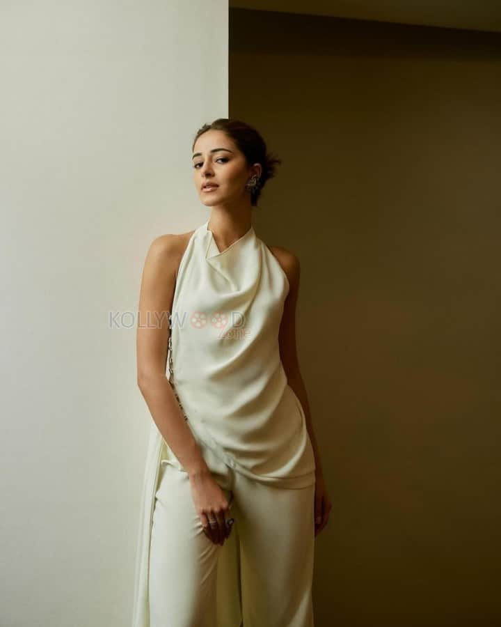 Sophisticated Ananya Panday in a White Halter Top with a Cowl Neckline and Trousers Photos 02