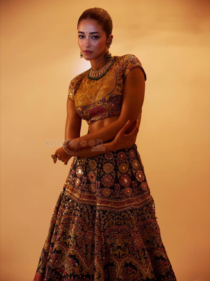 Stunning Ananya Panday in a Black Hand Embroidered Lehenga with a High Neck Mustard Yellow Blouse Photos 01