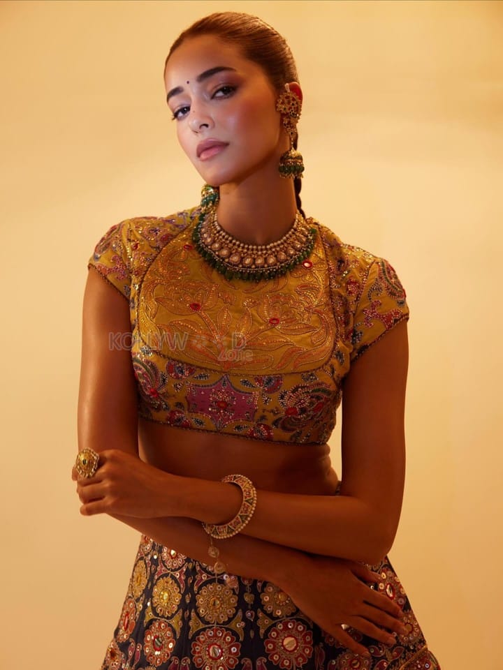 Stunning Ananya Panday in a Black Hand Embroidered Lehenga with a High Neck Mustard Yellow Blouse Photos 02