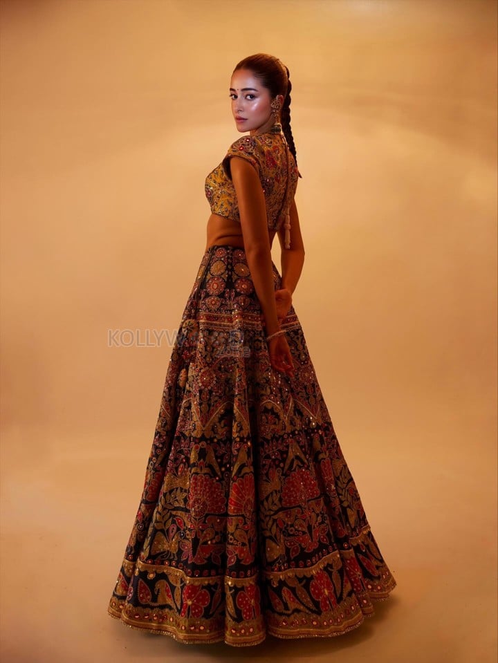 Stunning Ananya Panday in a Black Hand Embroidered Lehenga with a High Neck Mustard Yellow Blouse Photos 03