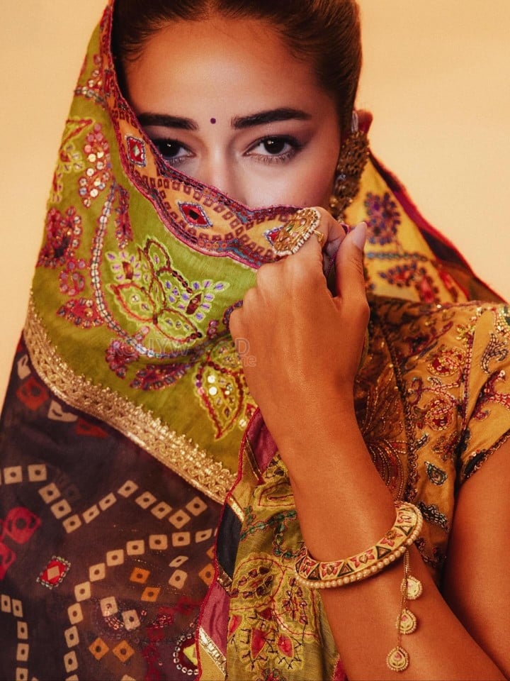 Stunning Ananya Panday in a Black Hand Embroidered Lehenga with a High Neck Mustard Yellow Blouse Photos 06