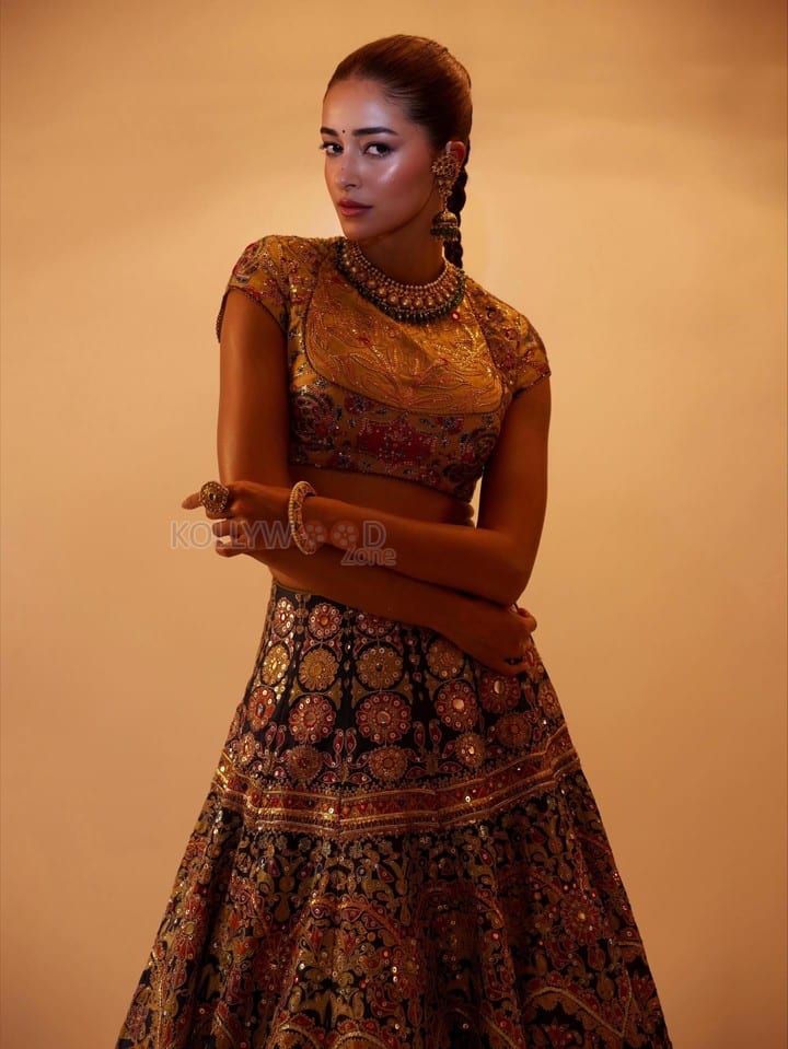 Stunning Ananya Panday in a Black Hand Embroidered Lehenga with a High Neck Mustard Yellow Blouse Photos 07