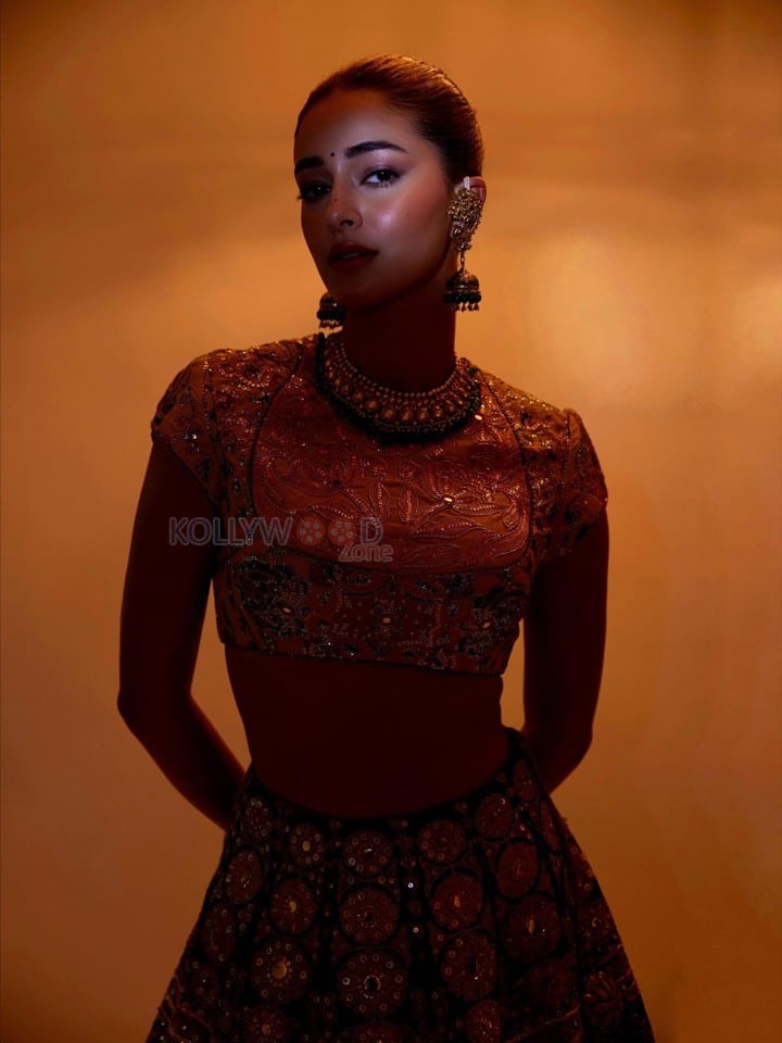 Stunning Ananya Panday in a Black Hand Embroidered Lehenga with a High Neck Mustard Yellow Blouse Photos 08