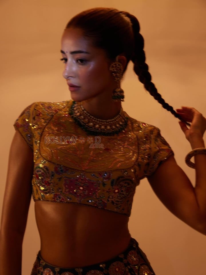 Stunning Ananya Panday in a Black Hand Embroidered Lehenga with a High Neck Mustard Yellow Blouse Photos 09