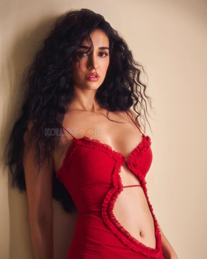 Stunning Hot Disha Patani in a Red Cut Out Deep Neckline Dress Photos 02
