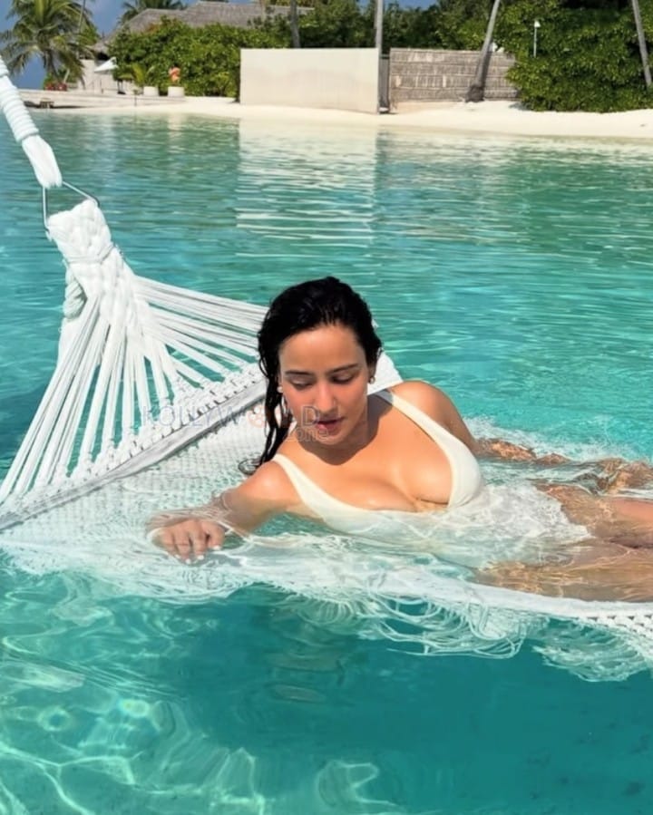 Stunning Hot Neha Sharma in a White Pool Bikini Photos 02