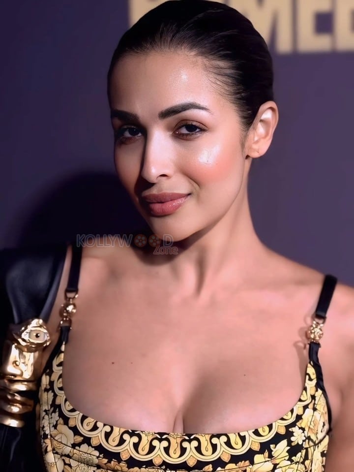 Stunning MILF Malaika Arora in a Black and Golden Cleavage Outfit Photos 02