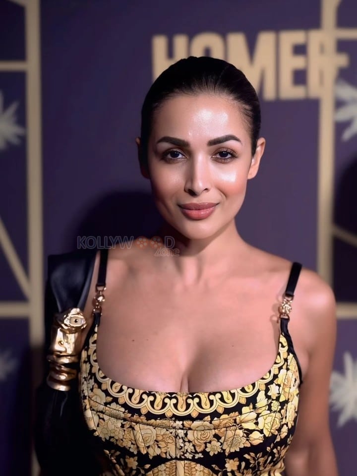 Stunning MILF Malaika Arora in a Black and Golden Cleavage Outfit Photos 03