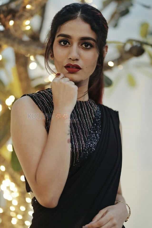 Stunning Priya Prakash Varrier in Black Georgette Embellished Saree Style Dress Photos 01
