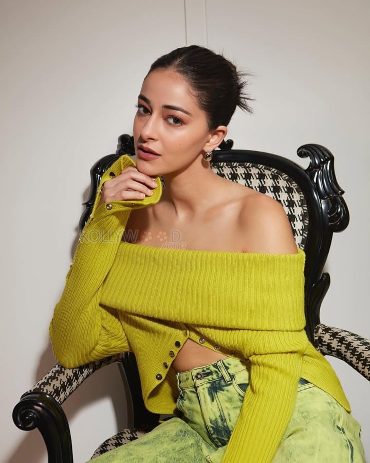 Stylish Ananya Panday in a Green Off Shoulder Knitted Blouse and Denim Jeans Photos 02