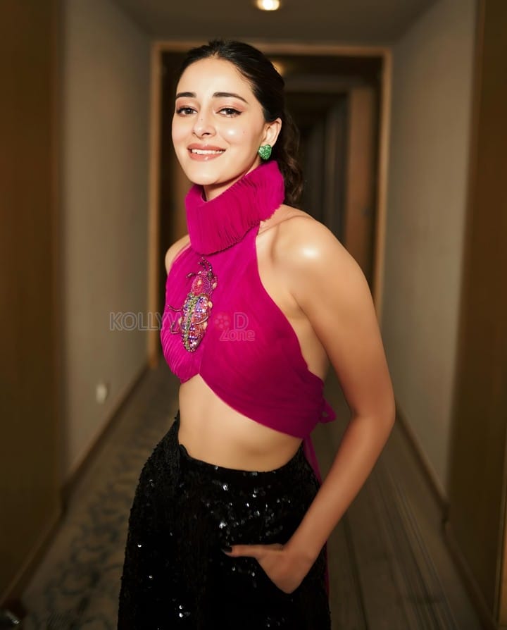 Stylish Ananya Panday in a Pink Turtleneck Crop Top with Black Glittering Pants Photos 01