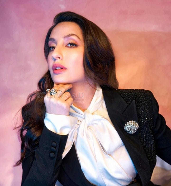 Stylish Nora Fatehi in a Black Power Suit Photos 01